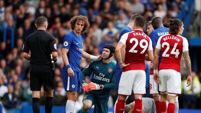 Chelsea's David Luiz is shown a yellow card by referee Michael Oliver. Luiz would later be sent off. John Sibley / Reuters