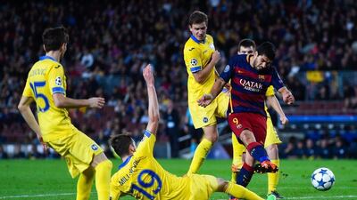 Luis Suarez of Barcelona shoots and scores their second goal on Wednesday night against Bate Borisov in the Champions League. David Ramos / Getty Images