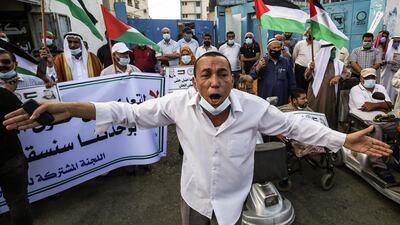 A Palestinian man takes part in a rally to protest against the reduction of the food basket provided by the United Nations relief fund in the town of Khan Yunis in the Southern Gaza Strip. AFP