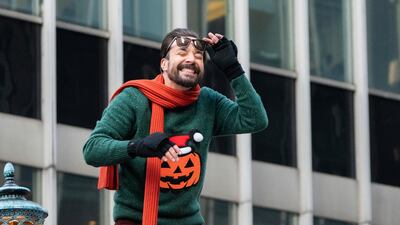 Jimmy Fallon rides on a float. AP Photo