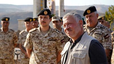 Jordan’s King Abdullah II, second right, tours the Baqura enclave formerly leased by Israel with Crown Prince Hussein and military officers, Monday, November 11, 2019. AP