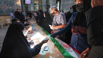Iranians register to vote at a polling station in the Hosseinyeh Ershad mosque in the capital Tehran during the country's presidential election. AFP