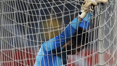 Egypt keeper Sherif Ekrami reacts after the final on Tuesday night, as the Egyptians' 24-year World Cup drought was extended by another four. Amr Abdallah Dalsh / Reuters