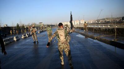 An Afghan National Army soldier walks at the site of a suicide attack near the Defence Ministry compound, in Kabul, Afghanistan, on February 27, 2016. AP Photos/Massoud Hossaini