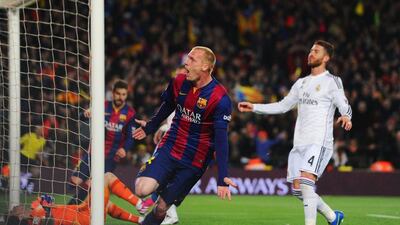 Jeremy Mathieu of Barcelona begins to celebrate after scoring the opening goal in his side's 2-1 La Liga win over Real Madrid on Sunday night at the Camp Nou. Alex Caparros / Getty Images / March 22, 2015