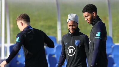 England's Raheem Sterling, centre, and Joe Gomez, right. Reuters