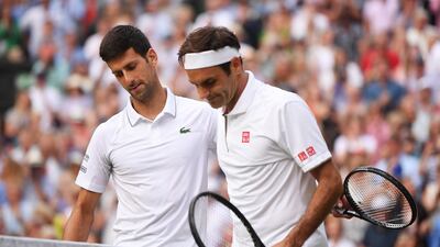Novak Djokovic, left, commiserates with Roger Federer after beating the Swiss in the Wimbledon final. EPA