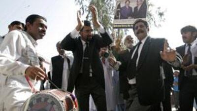 Lawyers dance as they celebrate the government's decision to reinstate Iftikhar Chaudhry as chief justice, in Hyderabad March 16, 2009.