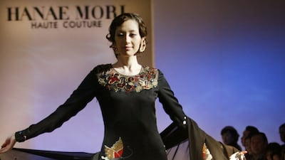 A Mori outfit from spring/summer 2003. The black silk dress shows her signature butterfly motif as well as hand-printed waves, inspired by Japanese painter Hokusai, known for his woodblock painting 'The Great Wave'. Reuters