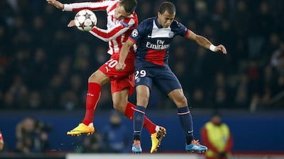 Lucas, right, and Paris Saint-Germain are still unbeaten in Ligue 1 as the calendar prepares to flip over to 2014. Charles Platiau / Reuters