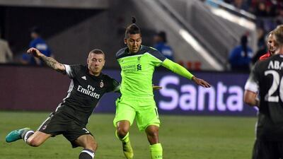 Liverpool forward Roberto Firmino (C) controls the ball during an International Champions Cup match against AC Milan at Levi’s Stadium in Santa Clara, California on July 30, 2016. Josh Edelson / AFP