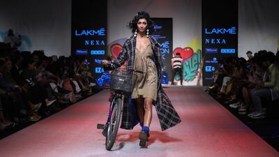 A shift dress and jacket combo on the Aneeth Arora runway. EPA