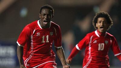 Ahmed Khalil, left celebrates after scoring his second goal to level the game against Uzbekistan at 2-2 while Omar Abdulrahman looks on. Sammy Dallal / The National