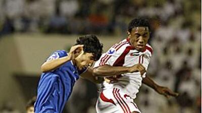 Al Ahli's Ahmed Khalil, right, is likely to train at Chelsea.