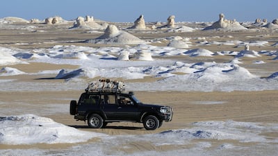 Desert safari vehicles drive along the White Desert in Egypt. EPA
