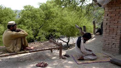 A miner performs afternoon prayers at a coal mine in Choa Saidan Shah, Punjab. Sara Farid / Reuters