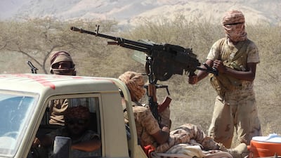 Yemeni fighters loyal to the government backed by the Saudi-led coalition ride in the back of a pickup truck while closing in on a suspected location of an Al-Qaeda in the Arabian Peninsula (AQAP) leader during their the offensive in the Mesini Valley in the vast province of Hadramawt in February. Saleh Al-Obeidi / AFP
