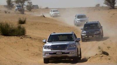 Big chill: Two women get snug in winter clothes during a walk along the beach near Jumeirah Beach Residence, Dubai. The temperature fell below freezing in some parts of the country during the week. Jeff Topping / The National