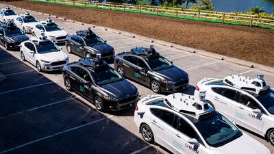 Driverless vehicles such as these Uber cars will be on UK roads soon. AFP