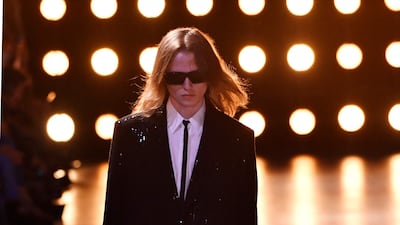 There were also sharp suits paired with skinny ties, a Slimane signature. AFP