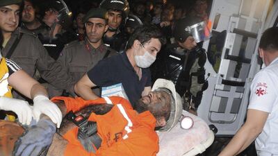 An injured miner is carried to an ambulance in Soma. An explosion and fire in the coal mine in western Turkey killed at least 200 mindes on Tuesday and many more have been trapped in the mine. Depo Photos / Reuters
