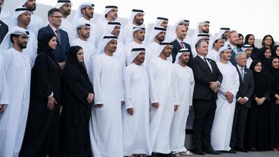 Sheikh Mohamed bin Zayed, stands for a group photo with employees of the Abu Dhabi Airport Company during a Sea Palace barza. Seen with Sheikh Suroor bin Mohamed (5th L) and Sheikh Mohamed bin Hamad (7th L). Hamad Al Kaabi / Ministry of Presidential Affairs