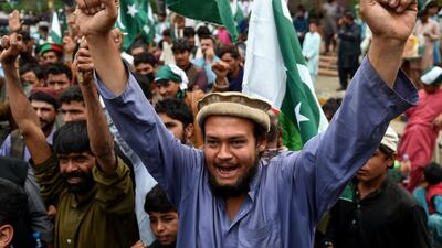 Pakistani demonstrators hold national flags and shout slogans during an anti-Indian protest in Karachi on March 3, 2019. AFP