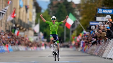 Slovenia's Tadej Pogacar crosses the finish line to win the Men Elite road race of the Cycling and Para-cycling Road World Championships in Zurich, Switzerland, Sunday, Sept. 29, 2024. (AP Photo / Peter Dejong)