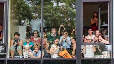 Spectators watch the arrival of Britain's Prince William, Duke of Cambridge and Catherine, Duchess of Cambridge for a visit at the German Cancer Research Centre in Heidelberg. EPA