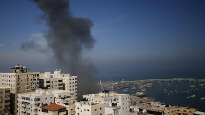Smoke billows above buildings in Gaza City during an Israeli air strike on the Palestinian enclave on May 5, 2019. AFP