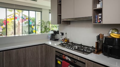 The kitchen. The family bought the villa off-plan, made possible by selling their previous house and moving into a smaller rental property temporarily