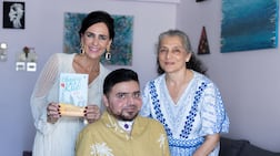 Sharan Budhrani with his mother Mansha, right, and author Margot de Ruiter Hooykaas. Ruel Pableo for The National