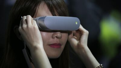 A woman uses the LG 360 VR headset during the LG unpacked 2016 event at the Mobile World Congress wireless show, in Barcelona. Manu Fernandez / AP Photo