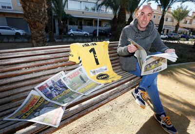 Alcoyano goalkeeper Jose Juan Figueiras reading newspapers with headlines dominated by his team's Copa del Rey victory over Real Madrid. EPA