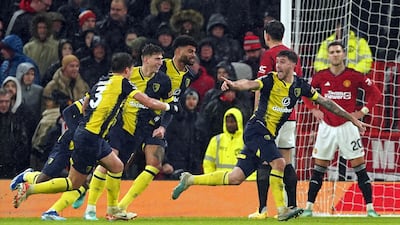 Bournemouth's Marcos Senesi, second right, celebrates scoring. PA