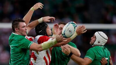 Japan's James Moore battles for the ball with Irish defenders during the Rugby World Cup Pool A game at Shizuoka Stadium Ecopa between Japan and Ireland in Shizuoka, Japan. AP Photo