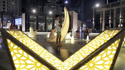 Kids and adults view a public art installation at JBR's The Walk in celebration of Ramadan. July 9, 2015. Jeffrey E Biteng / The National