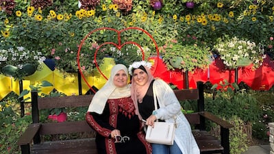 Sarah Afaneh, left, with her Palestinian grandmother at Dubai Miracle Garden