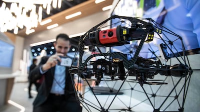 Dewa shows off a drone.