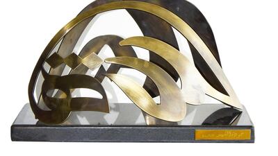 Helmet Martyr, stainless steel coating and textured bronze on a granite base. Courtesy Jamal Al Suwaidi