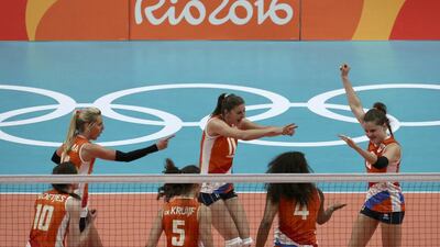 Yvon Belien (NED) of Netherlands (R) celebrates a point with team mates. REUTERS/Pilar Olivares