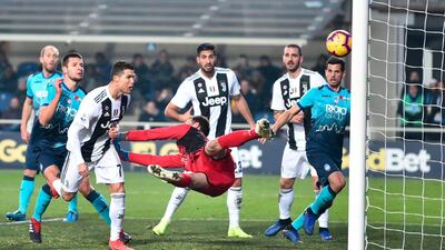 Juventus' Cristiano Ronaldo, third from left, scores his side's second goal during the Serie A soccer match between Atalanta and Juventus in Bergamo, Italy. AP