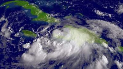 Tropical Storm Gustav is expected to be upgraded to a hurricane as it clears land and hits the warm water of its projected track into the Gulf of Mexico.