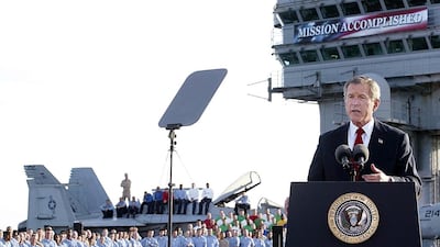 US President George W Bush addresses the nation aboard the nuclear aircraft carrier USS Abraham Lincoln in May 2013. Stephan Jaffe / AFP Photo