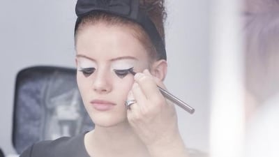 Models were sent down the runway with a tower of curls piled high on their heads, secured with oversized grosgrain hairbands. Olivier Saillant