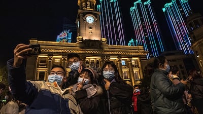 People take selfies as they celebrate the New Year in Wuhan, China. EPA