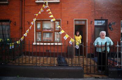 A woman waits for Pope Francis to drive past her house in Dublin. Reuters