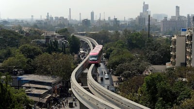 The monorail is part of a wider plan to decongest Mumbai’s heavy traffic and overcrowded trains and modernise the city. Above, a monorail train makes its way during a trial run last week. Indranil Mukherjee / AFP