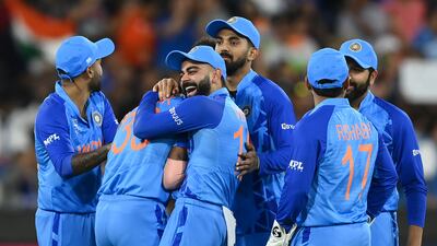 Virat Kohli congratulates Hardik Pandya on taking the wicket of Craig Ervine of Zimbabwe. Getty