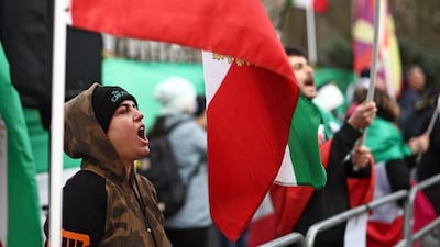 Protesters chant outside the embassy, demonstrating against the suppression of similar rallies, using brutal force, in Iran. AFP